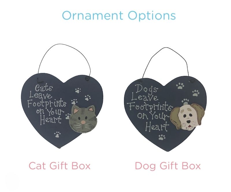 Select to view 'Heart-shaped hanging ornaments in navy with cat and dog faces, featuring the phrases 'Cats leave footprints on your heart' and 'Dogs leave footprints on your heart'.' image